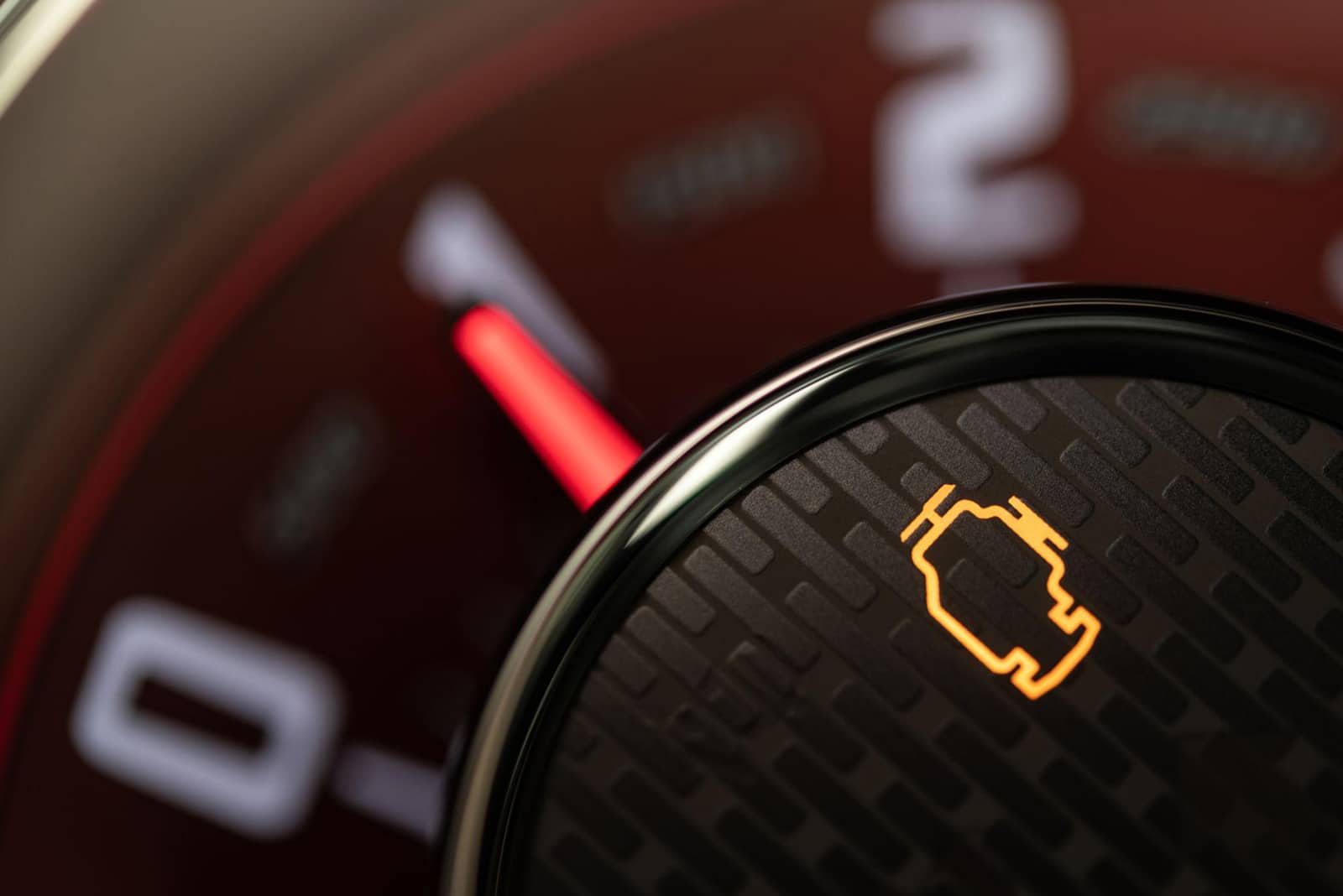 Illuminated check engine light on a car dashboard in Tampa, FL